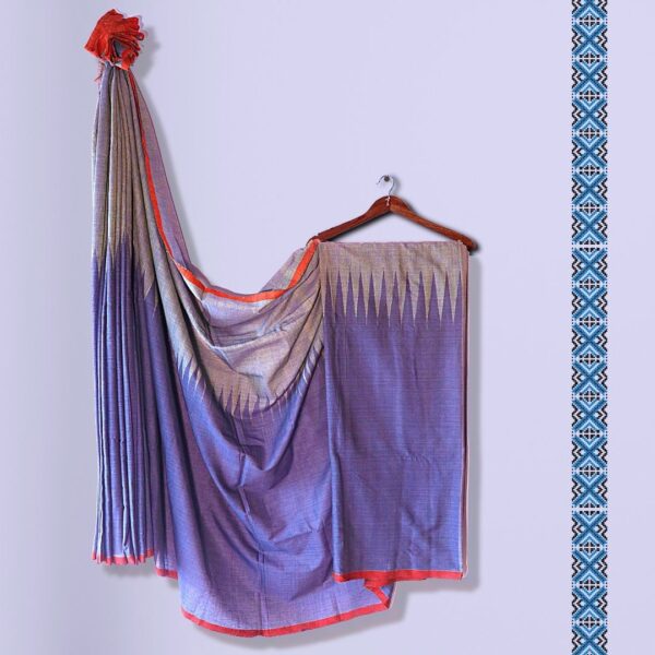 Blue Handloom Saree With Temple Design hung from a hanger